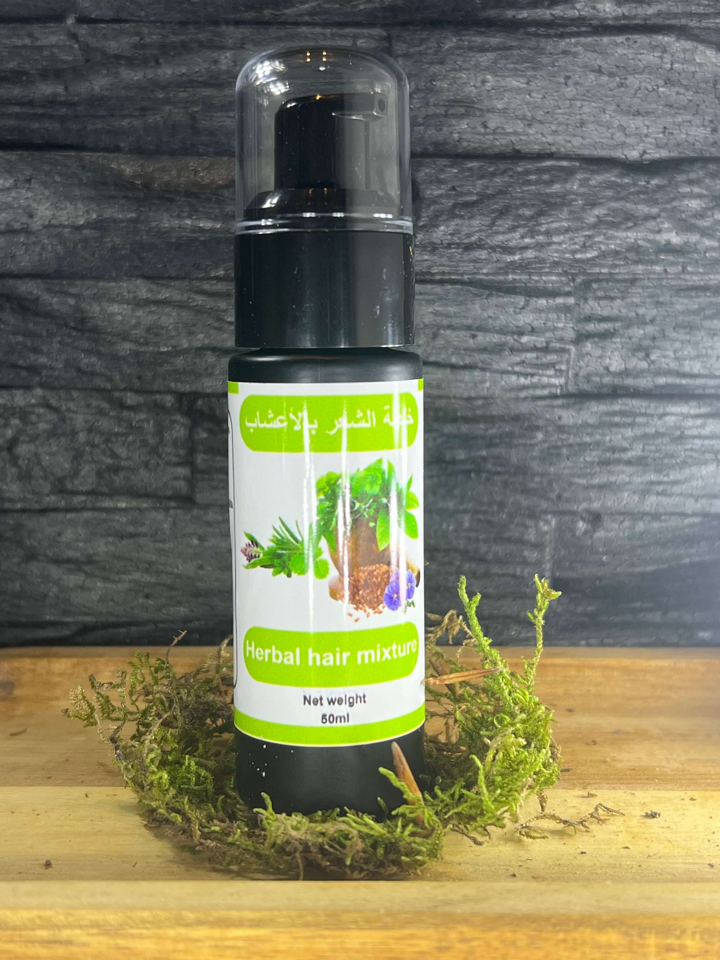 Herbal hair mixture bottle on wooden surface with moss, promotes hair growth and prevents hair loss, 80ml packaging.